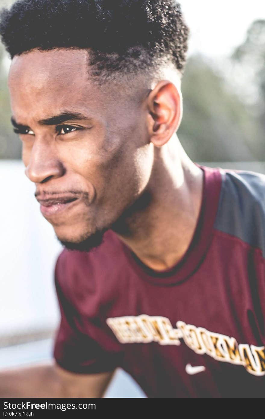 Man Wearing Maroon and Grey Crew-neck T-shirt