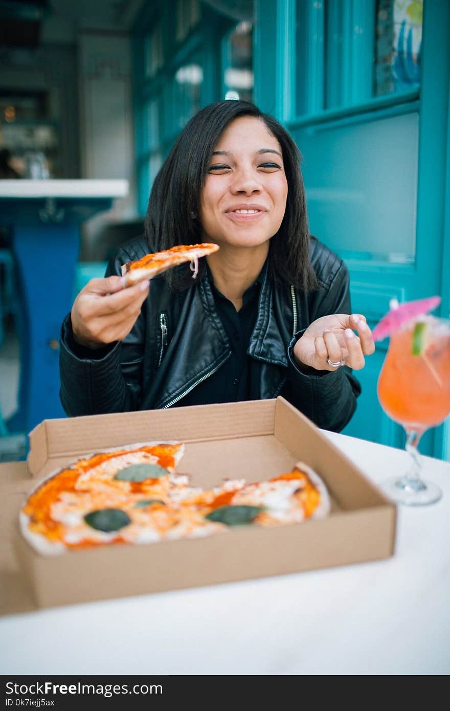 Woman Eating Pizza