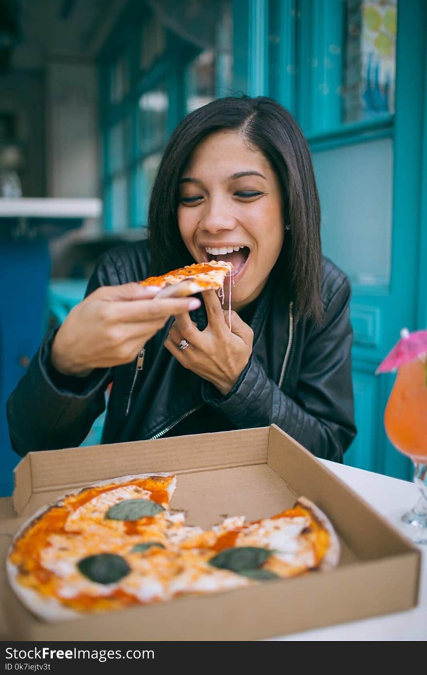 Photo of Woman Eating Pizza