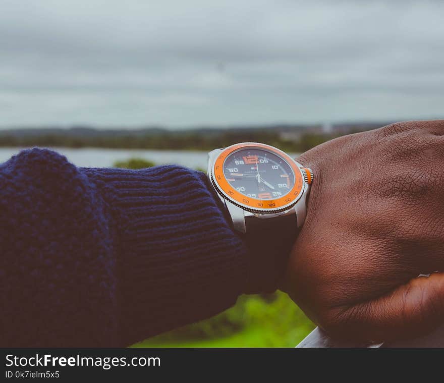 Photo of a Man Wearing Wristwatch