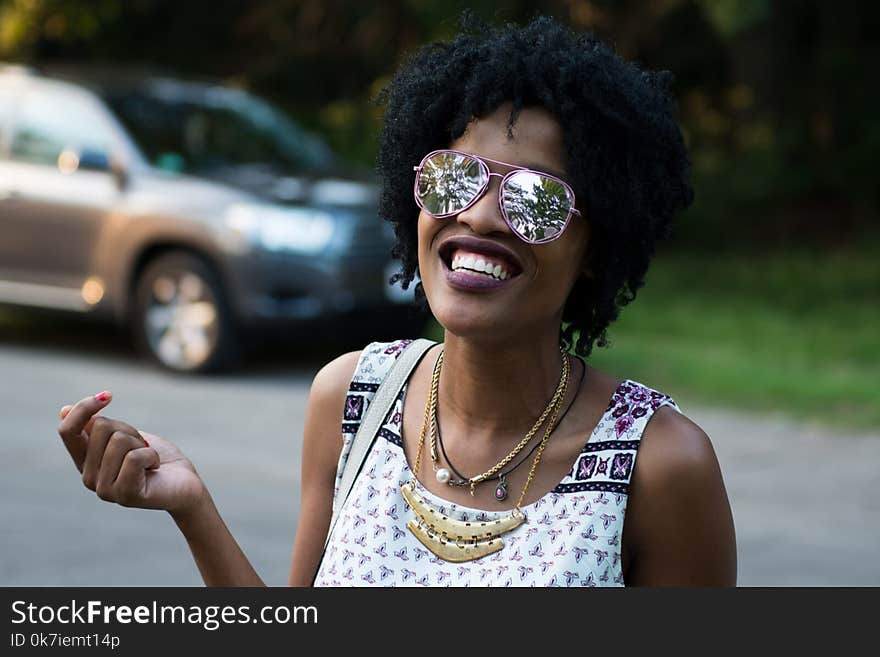 Woman Wearing Pink-framed Aviator Sunglasses