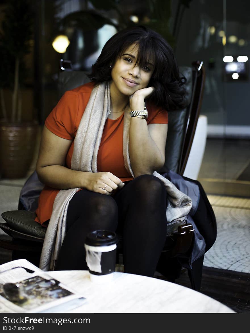 Photo of Woman Sitting on Chair