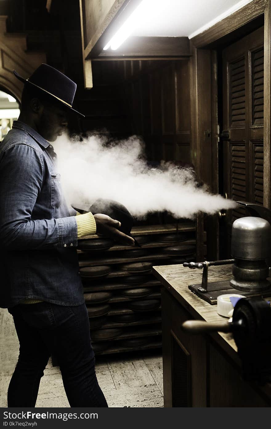 Man Standing with Steam Blowing Out