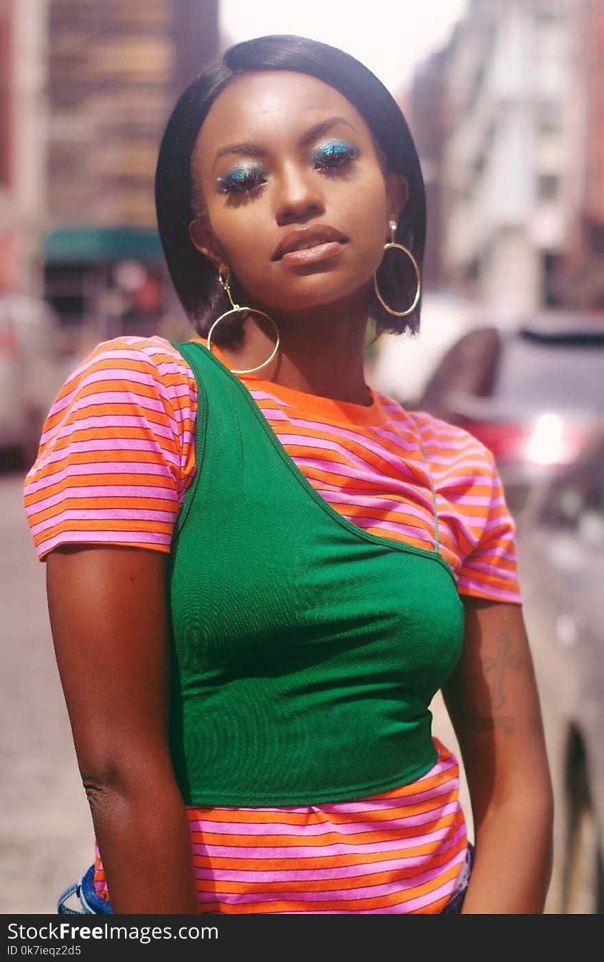 Woman Wearing Orange and Green Shirt