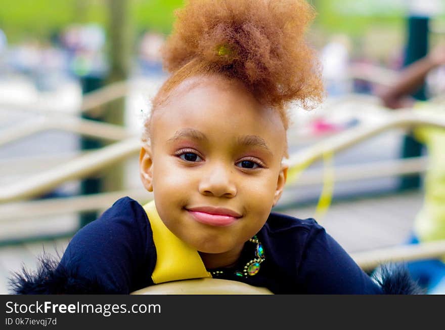 Girl in Blue Top Focus Photo