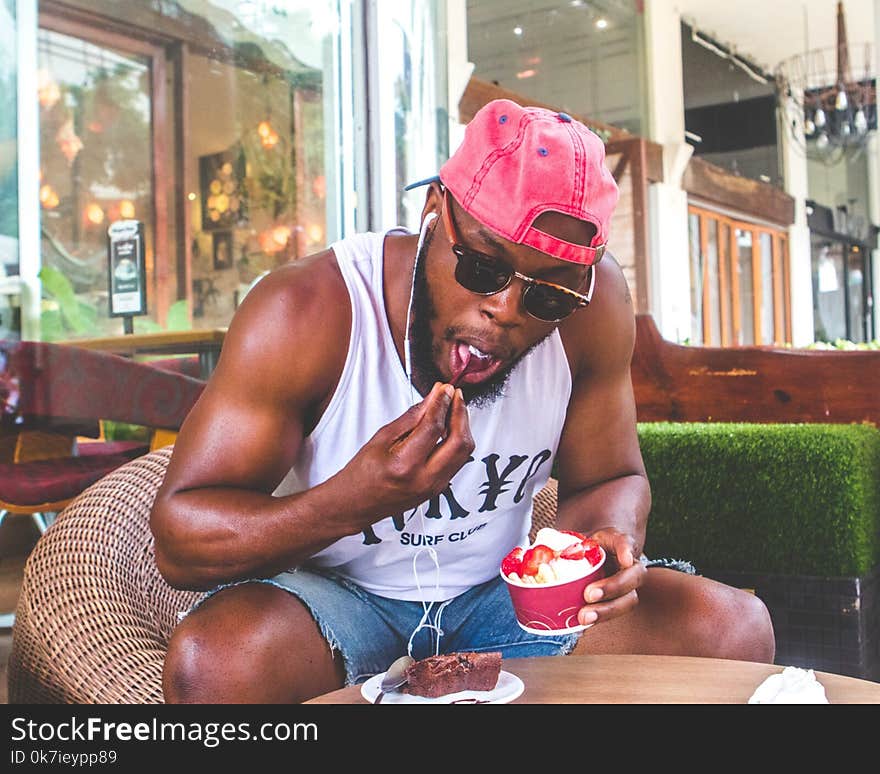 Man Eating Froyo With Strawberries