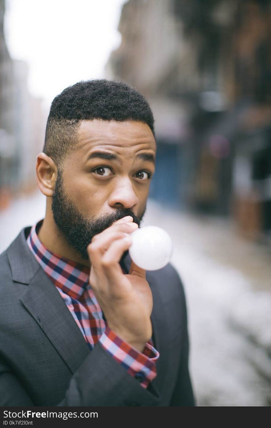 Selective Focus Photography of Man Wearing Gray Notch Lapel Suit Jacket