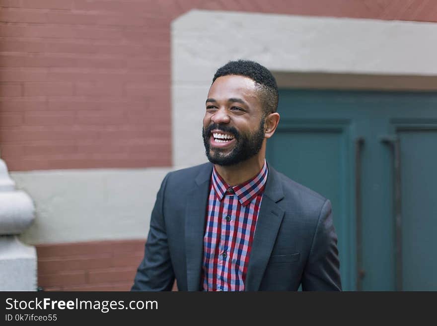 Man Wearing Black Notch Lapel Suit Jacket