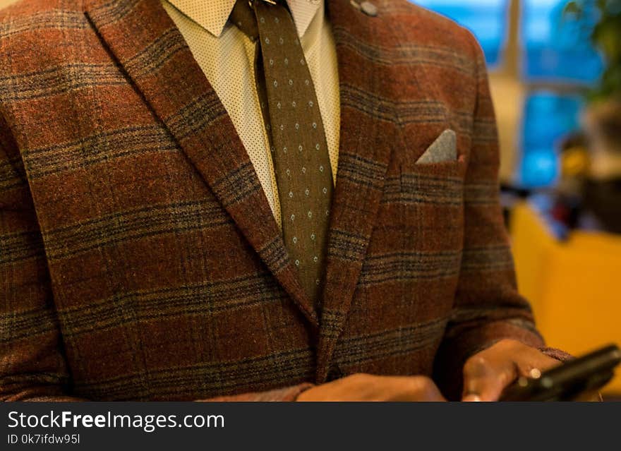 Person Wearing Red and Gray Plaid Suit Jacket