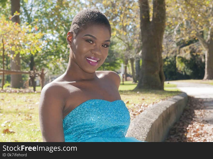 Woman Wearing Blue Strapless Top