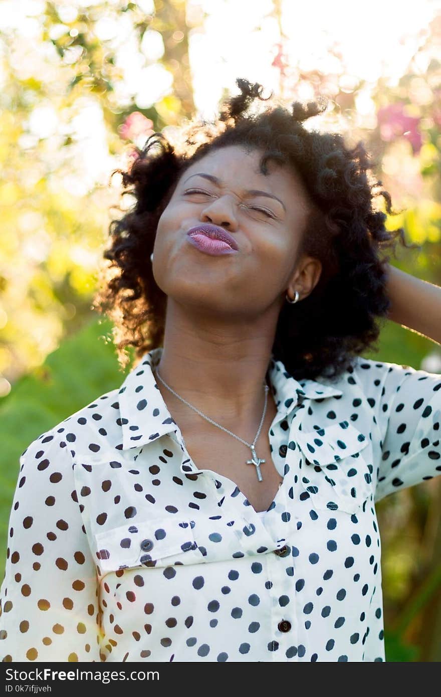 Woman in White and Black Polka-dot Blouse