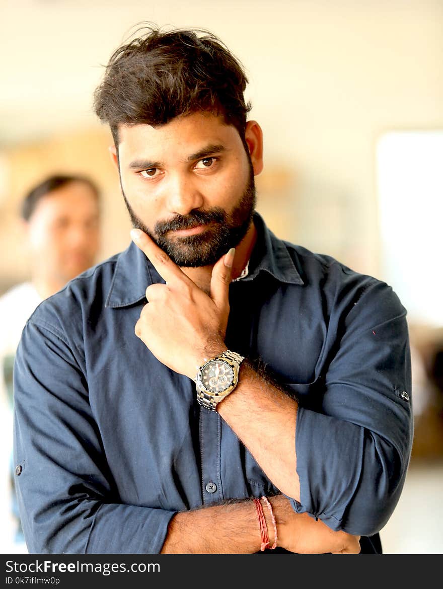 Photo of Man Wearing Gray Button-up Shirt With Analog Watch