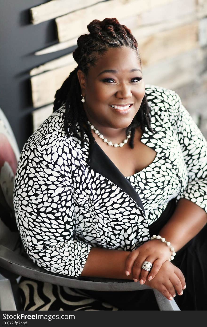 Smiling Woman Sitting on Chair