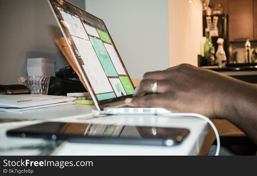 Person Using Laptop Computer Inside Room