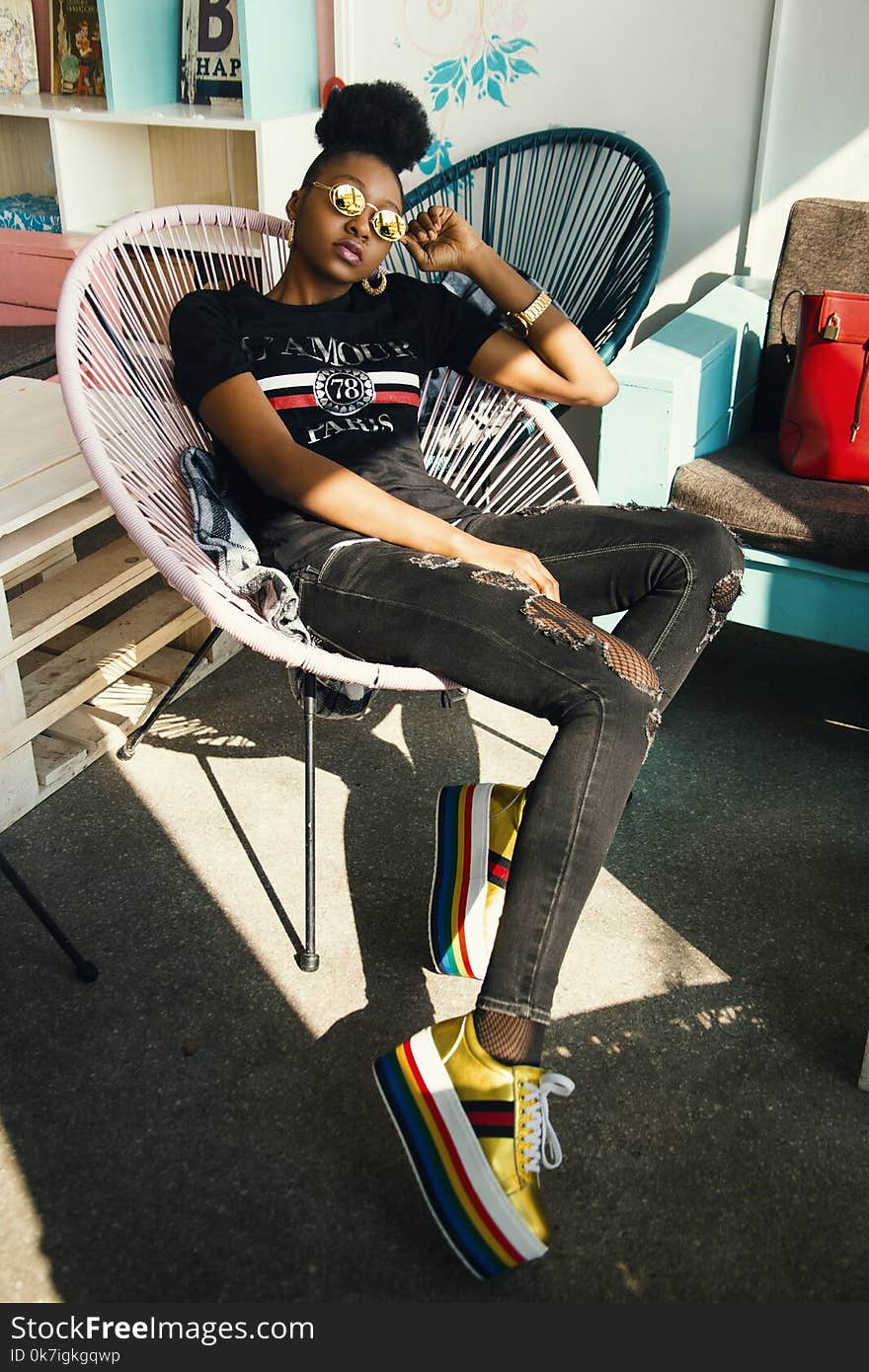 Photo of Woman Sitting on Chair