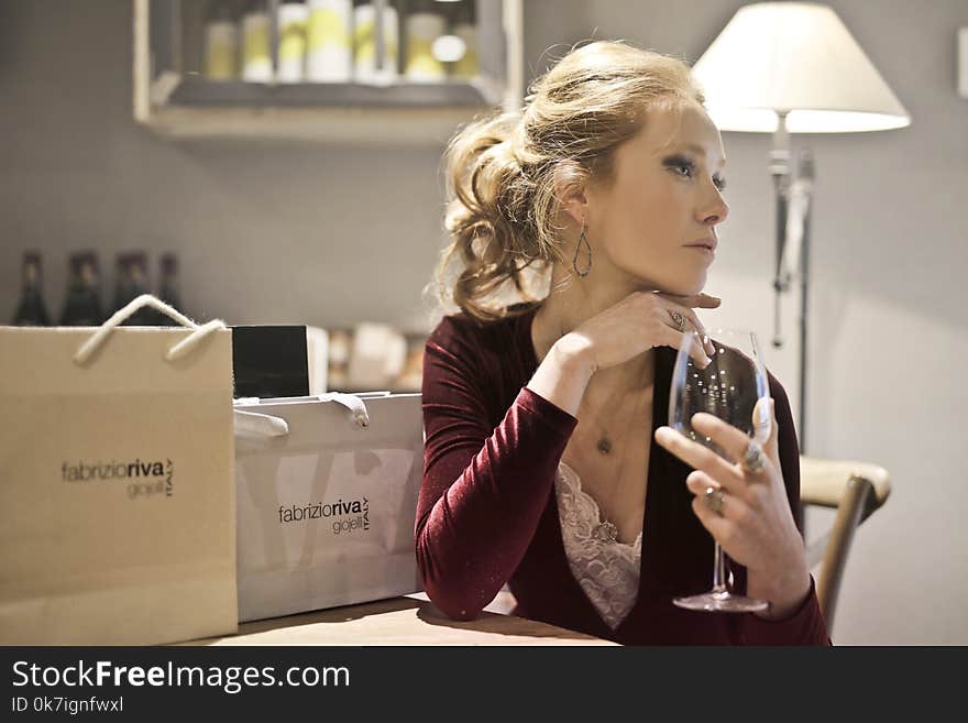 Woman in Purple and Pink Top Holding Wineglass