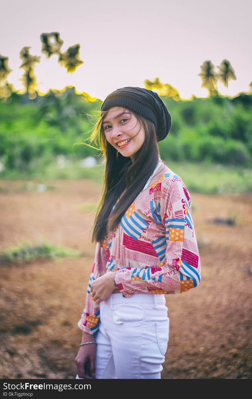 Photo of Woman Wearing Colorful Top