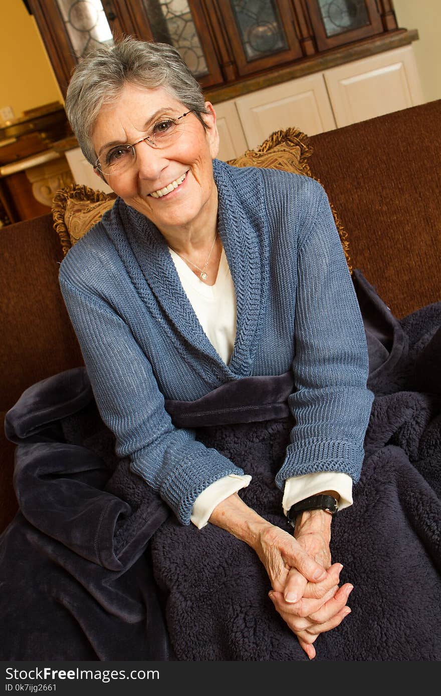 Confident mature older woman at home.