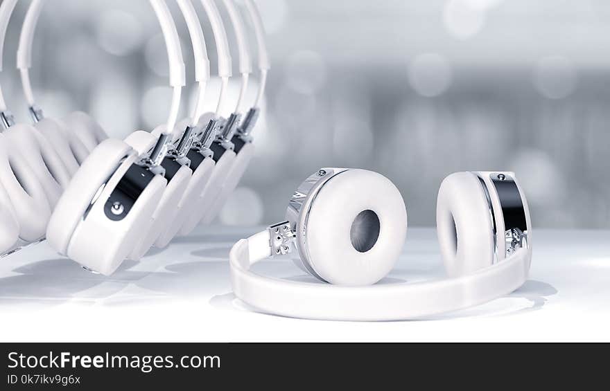 Headphone white color selective focus on abstract blurred background with copy space for your text.