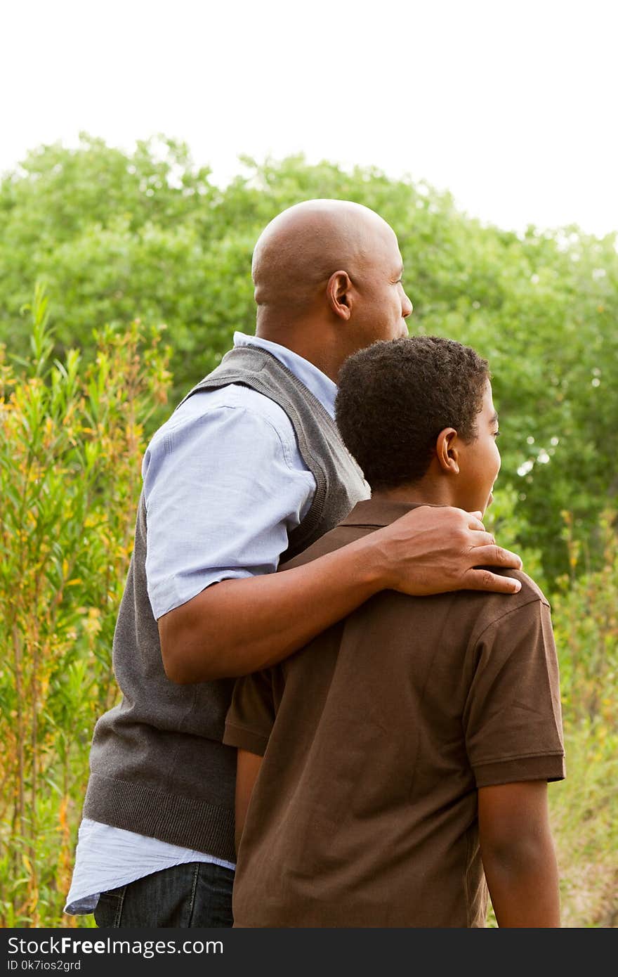 Father comforting his son.