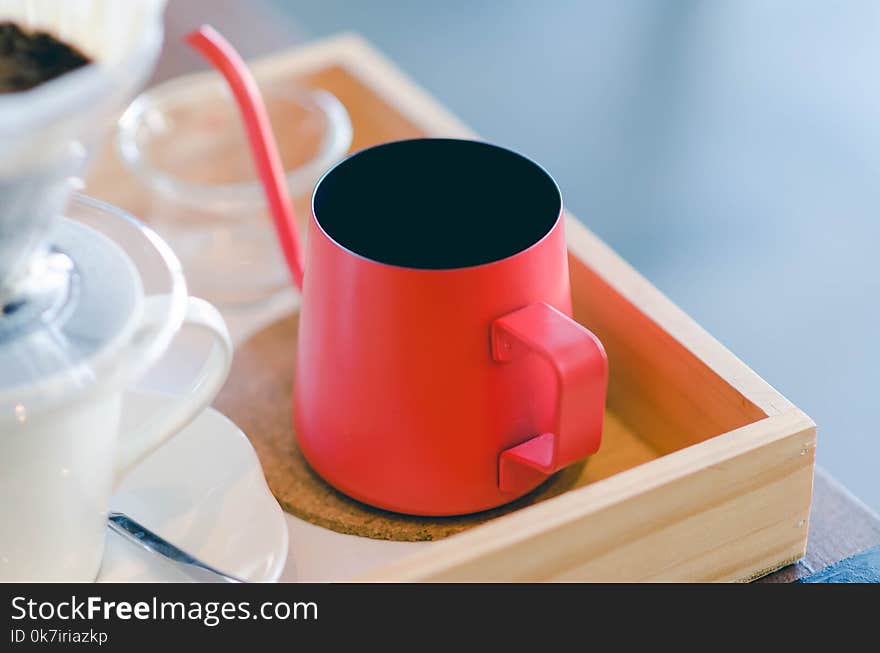 Close up red kettle with coffee dripping. Still life photography, Kit for making drip coffee.