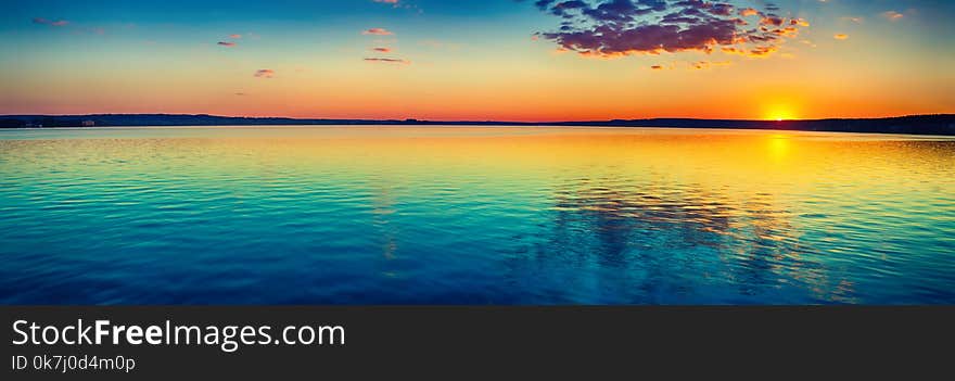 Sunset over the lake in Russia. Amazing landscape panorama. Sunset over the lake in Russia. Amazing landscape panorama