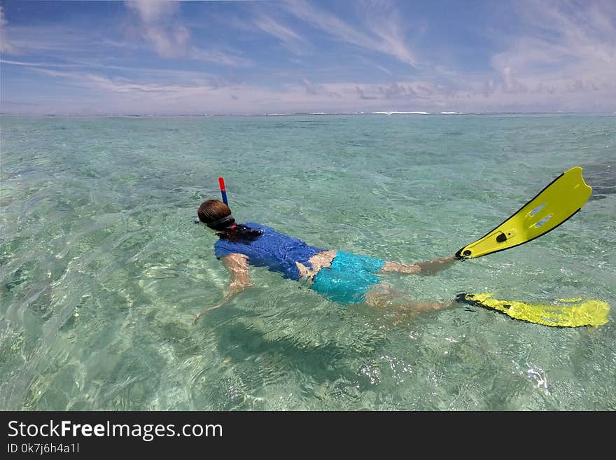 Young woman snorkelling in a lagoon in Rarotonga Cook Islands