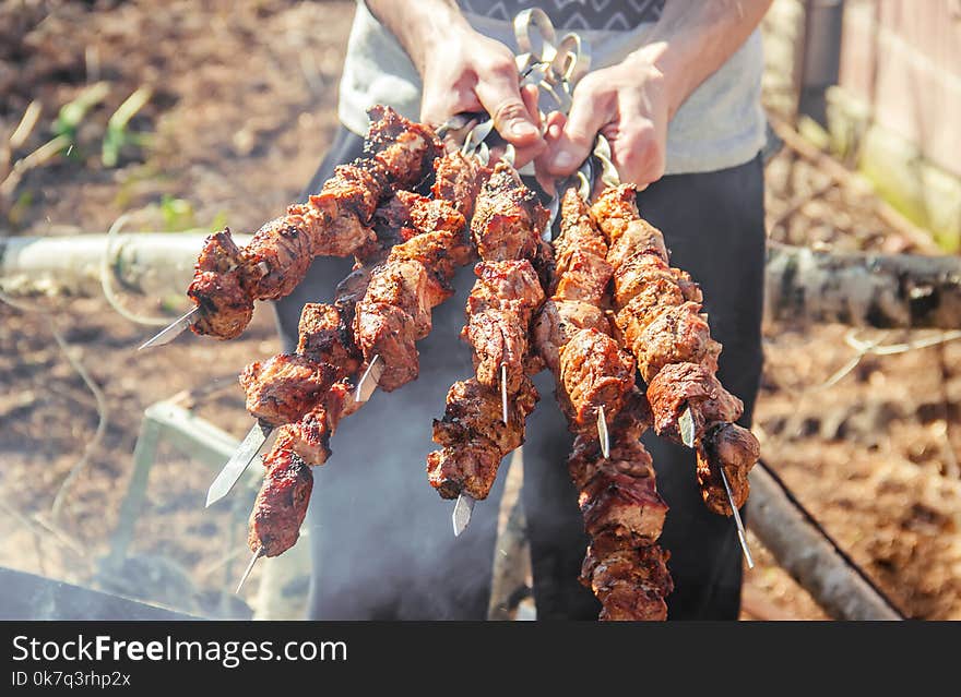 The meat is fried on the grill. Selective focus.