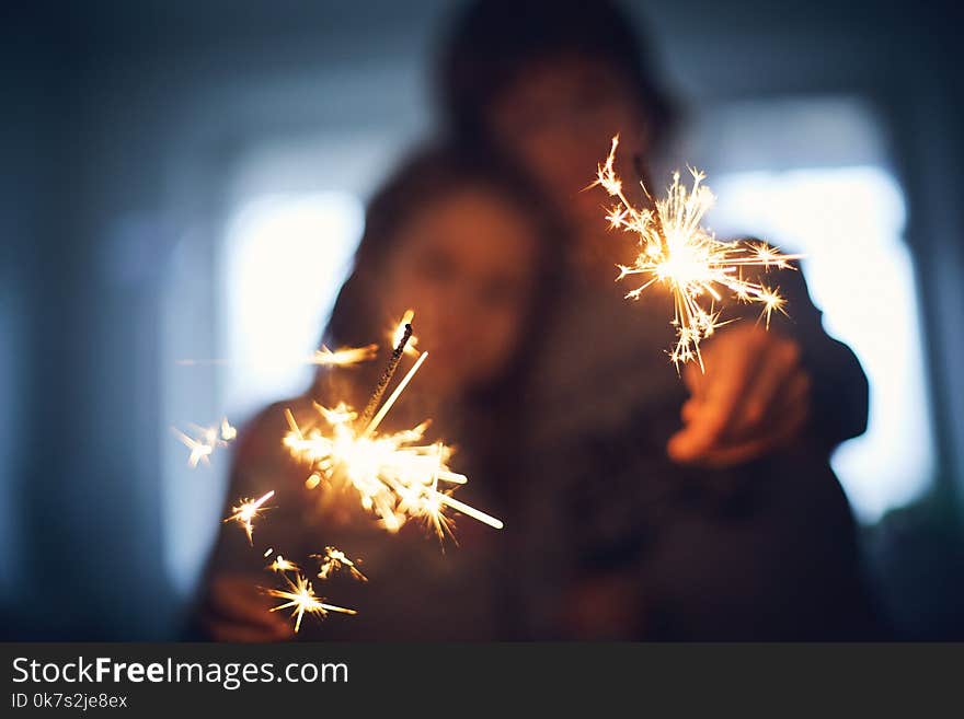 Children with Bengal lights. focus on the lights