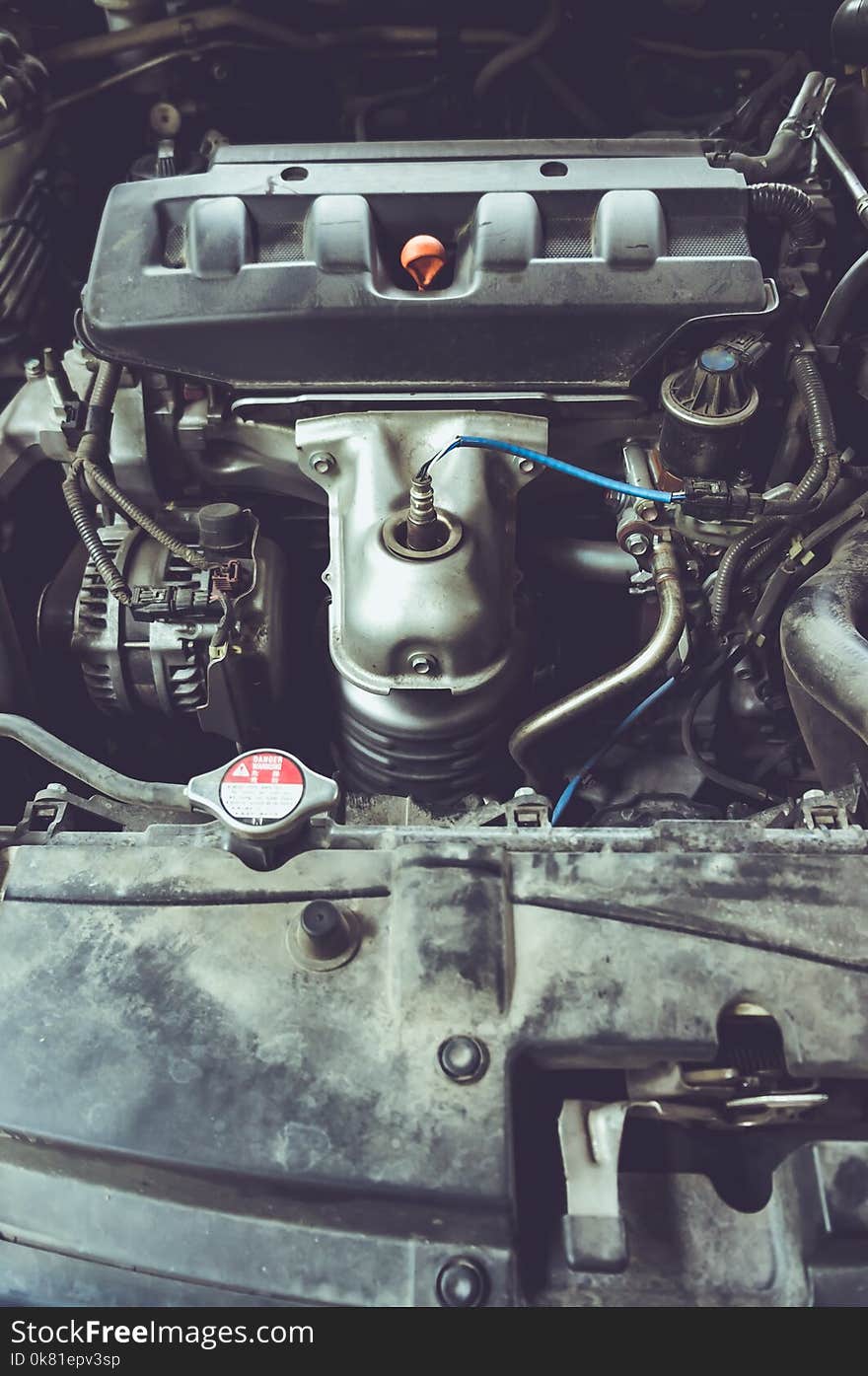 Top view. Automobile old engines of the car are dirty. Shallow depth of field, selective focus. Vintage film filter effect. Top view. Automobile old engines of the car are dirty. Shallow depth of field, selective focus. Vintage film filter effect.