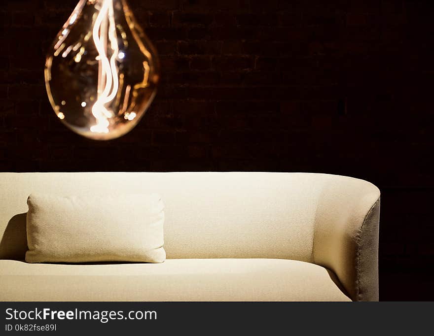 White Pillow on White Leather Sofa