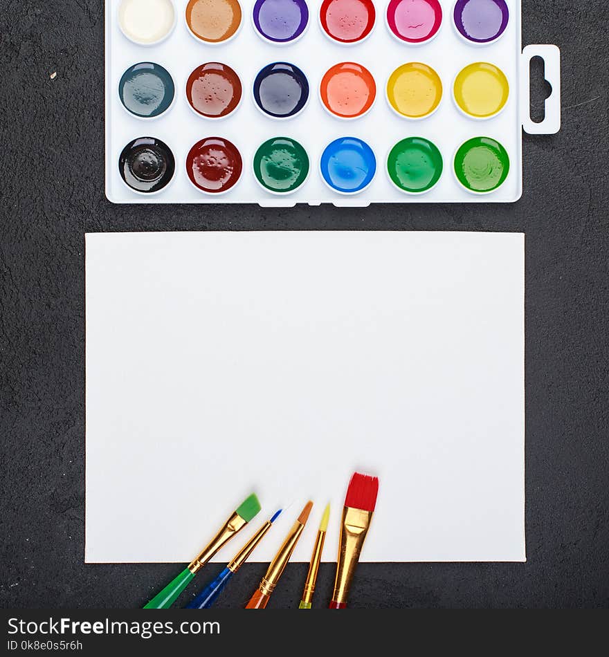 Blank paper and colorful pencils top view above. Blank paper and colorful pencils top view above