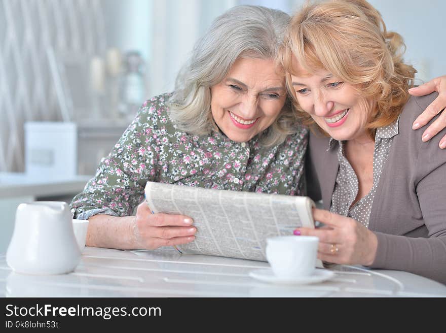 Senior women with newspaper