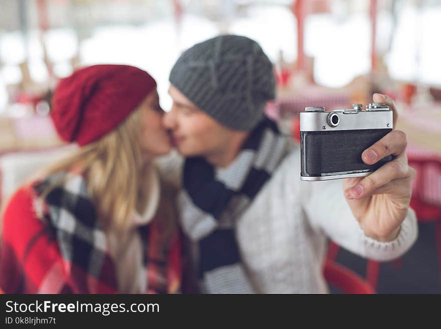 Young couple making selfie in a cafe