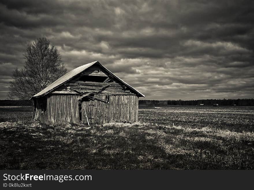 Rain Clouds Over The Old Barn House