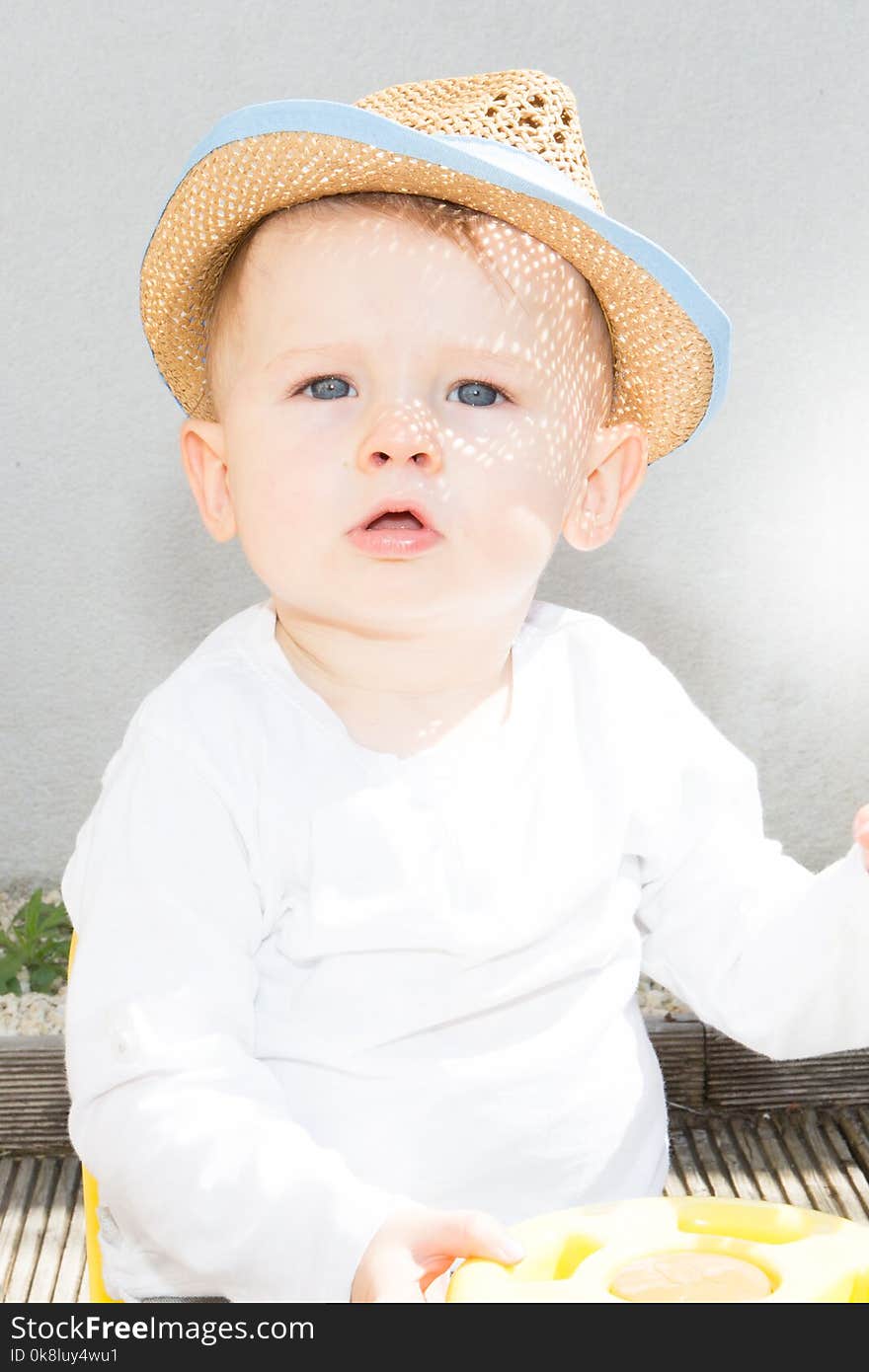 Portrait of a positive boy in a hat outdoor summer