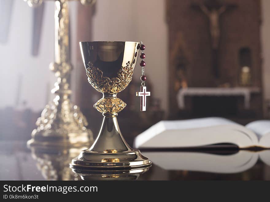 Holy communion concept. The Cross, Holy Bible, rosary and golden chalice. Holy communion concept. The Cross, Holy Bible, rosary and golden chalice.