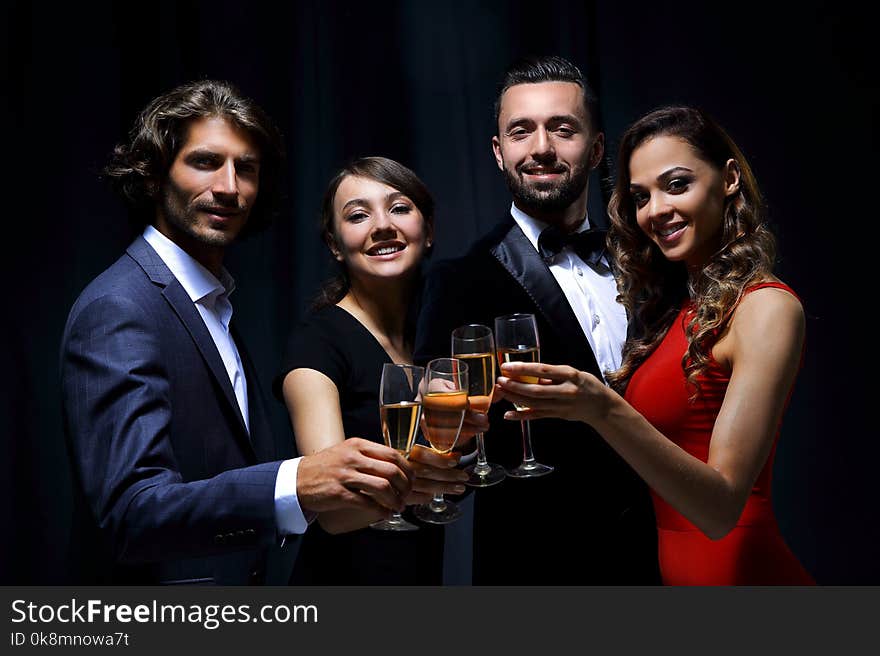 Cheerful People Celebrating A Sucess With Champagne