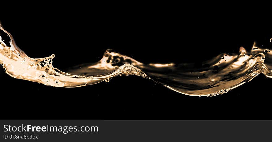 Water Smooth With Splashes On A Black Background