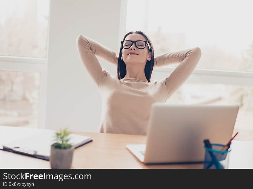 Leisure lifestyle comfort coziness concept. Portrait of peaceful calm beautiful harmonious elegant charming experienced carefree secretary holding head behind head casual clothes sitting light office