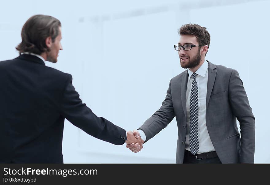 Handshake of business partners in the office of the Bank. Handshake of business partners in the office of the Bank