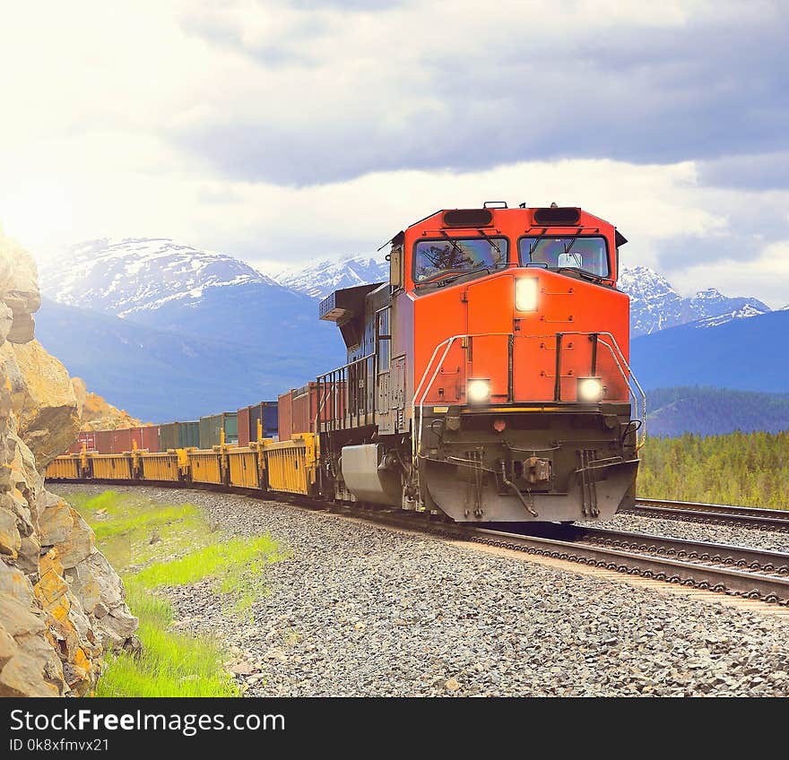 Long freight train moves through Canadian Rockies. Long freight train moves through Canadian Rockies.