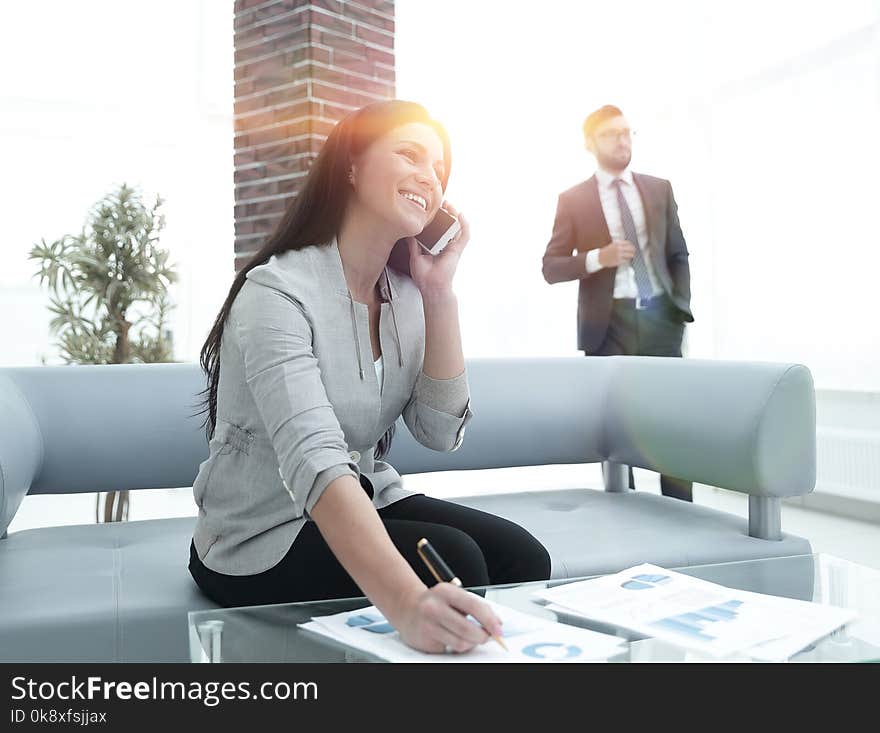 Woman assistant at the workplace in the office