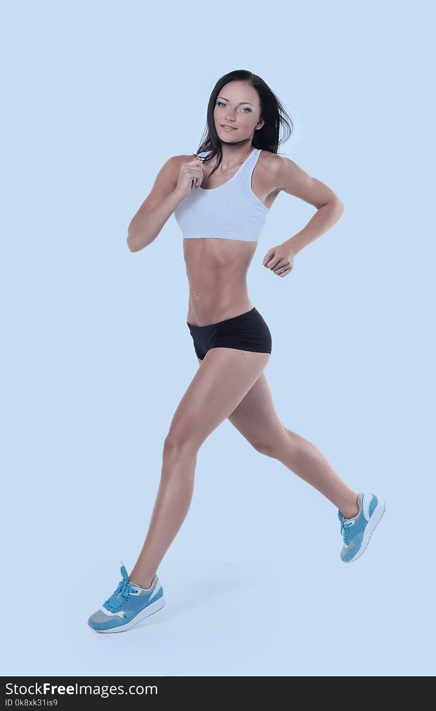 Attractive woman engaged in aerobic exercise