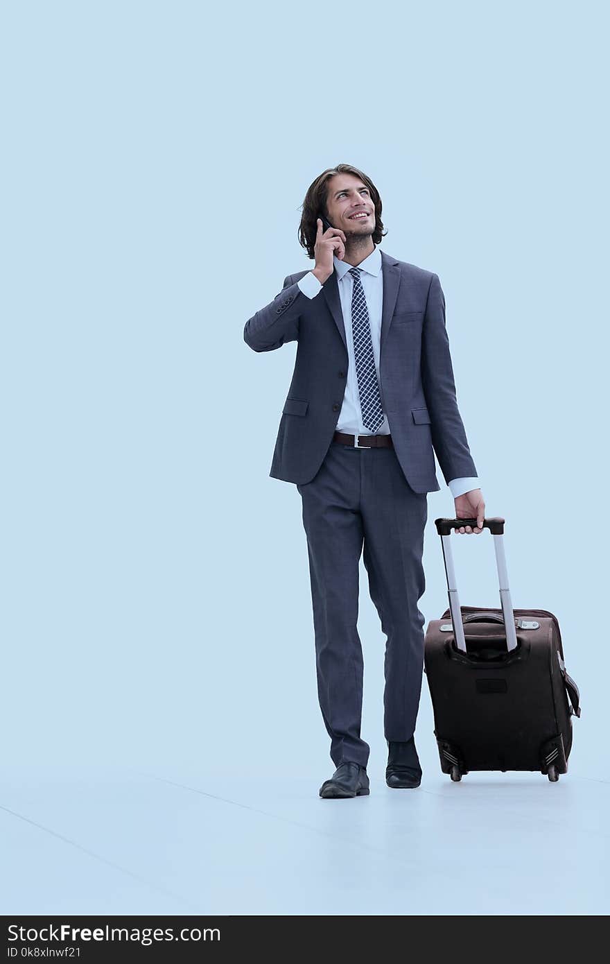 Successful businessman with travel suitcase