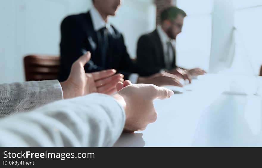 Closeup. business team sitting at their Desk.business background