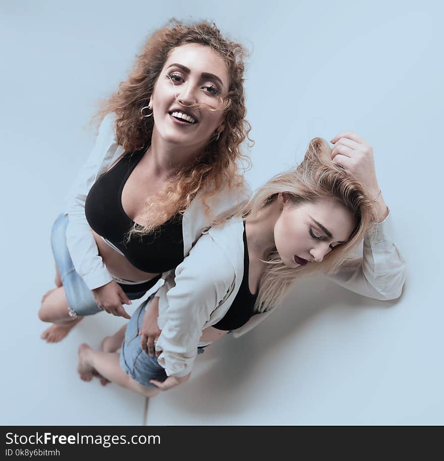 Two frustrated women standing near the walls