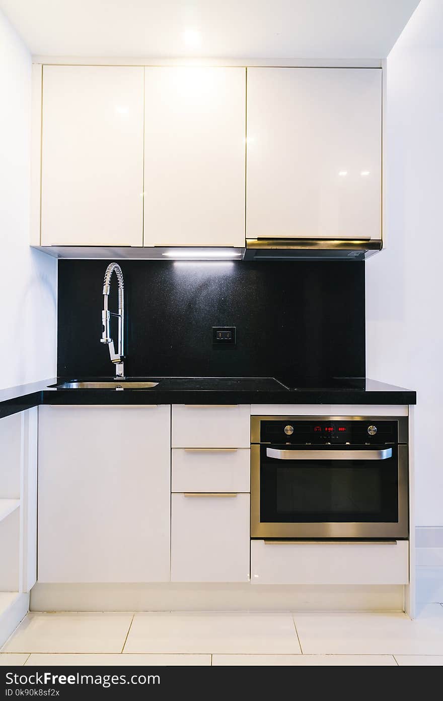 Faucet and sink decoration in kitchen room interior