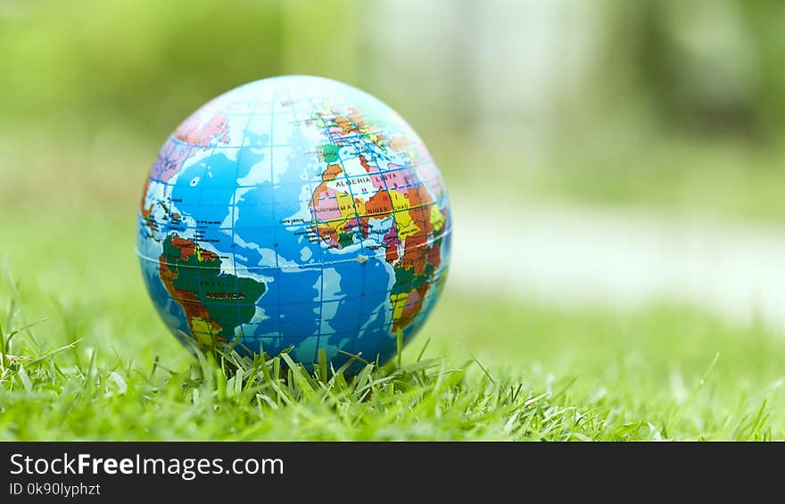 Earth Day ,Globe lies on green grass. Concept