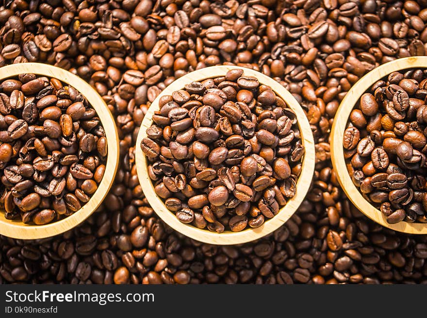 Brown Coffee Beans In Wood Bowl